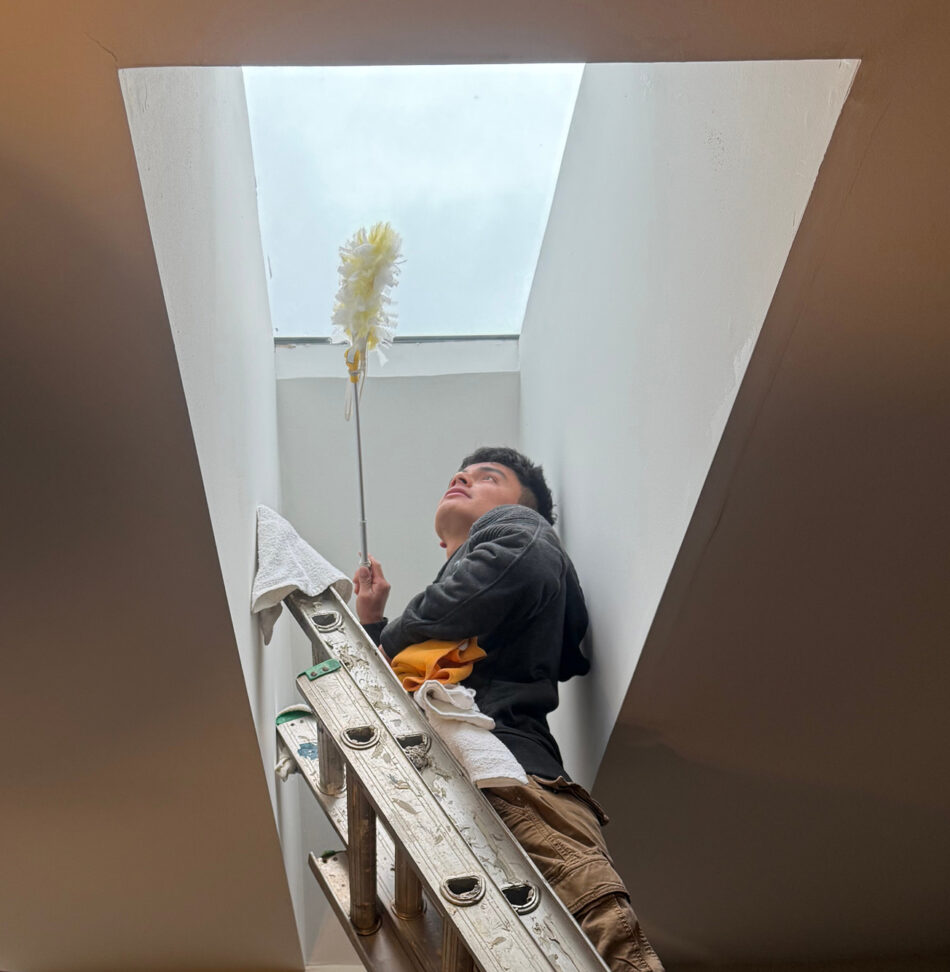 A provider with Professional Edge Cleaning performing their regular cleaning in a client's home.